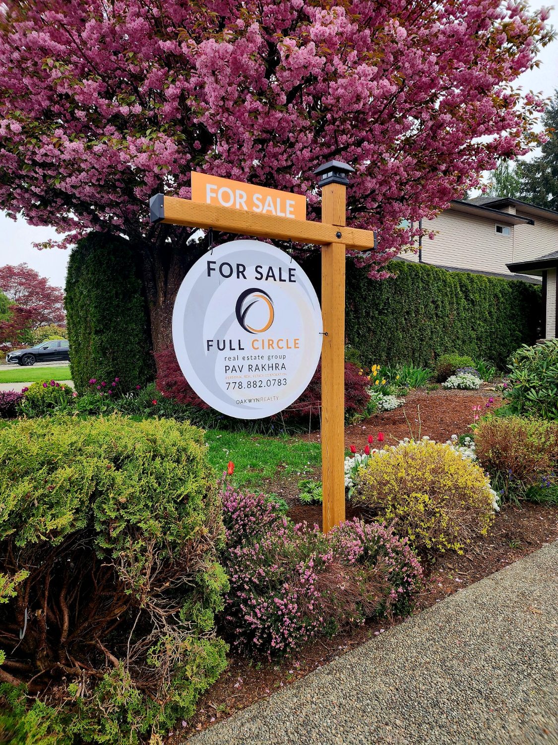 Natural wood circular sign installation