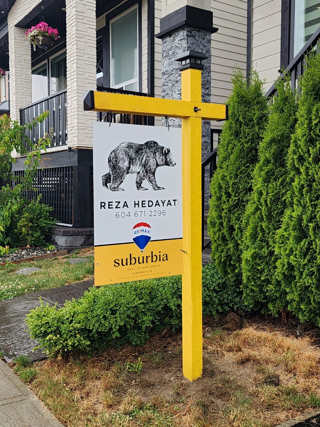 Yellow custom real estate sign post