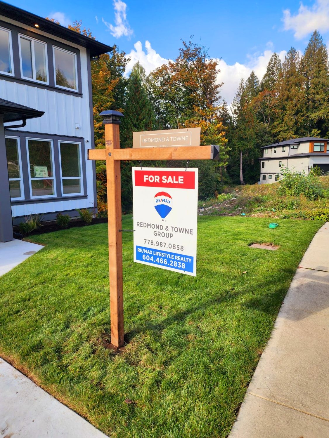 Natural wood residential sign post